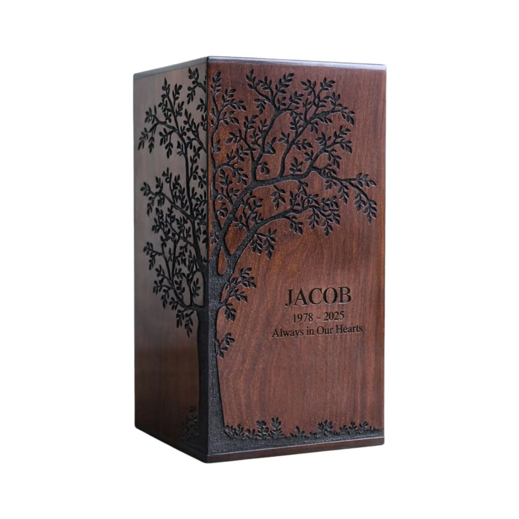 Personalized wooden urn box with engraved tree design and text on a white background