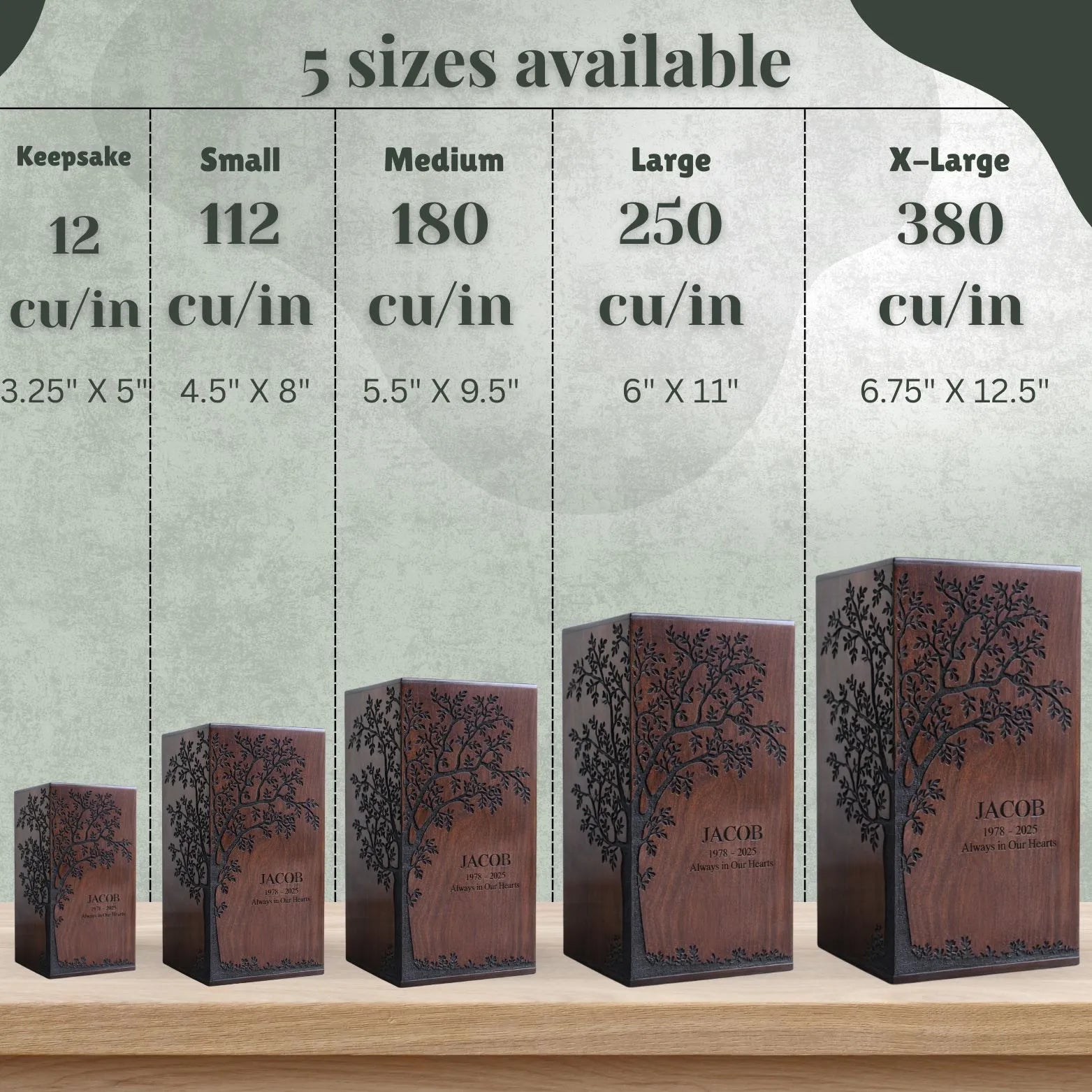 Wooden keepsake boxes of different sizes with tree design and 'JACOB' engraving, displayed against a neutral background.